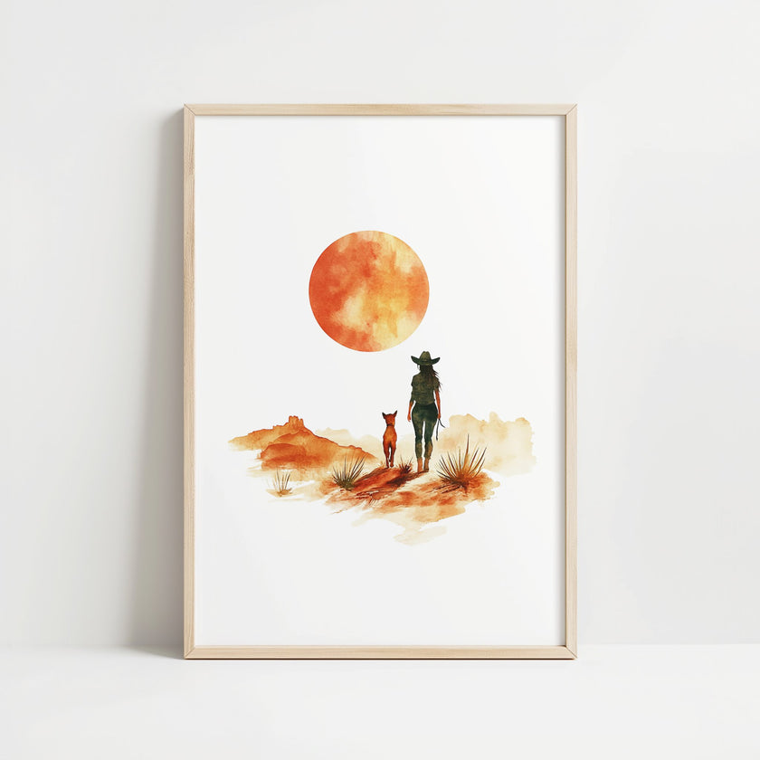 Minimalist watercolor print featuring silhouettes of a person and dog against a vivid burnt orange sunset in a desert landscape, conveying serenity and adventure in warm earthy tones.