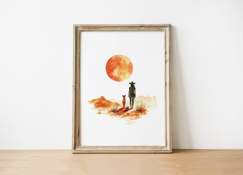 Minimalist watercolor print featuring silhouettes of a person and dog against a vivid burnt orange sunset in a desert landscape, conveying serenity and adventure in warm earthy tones.