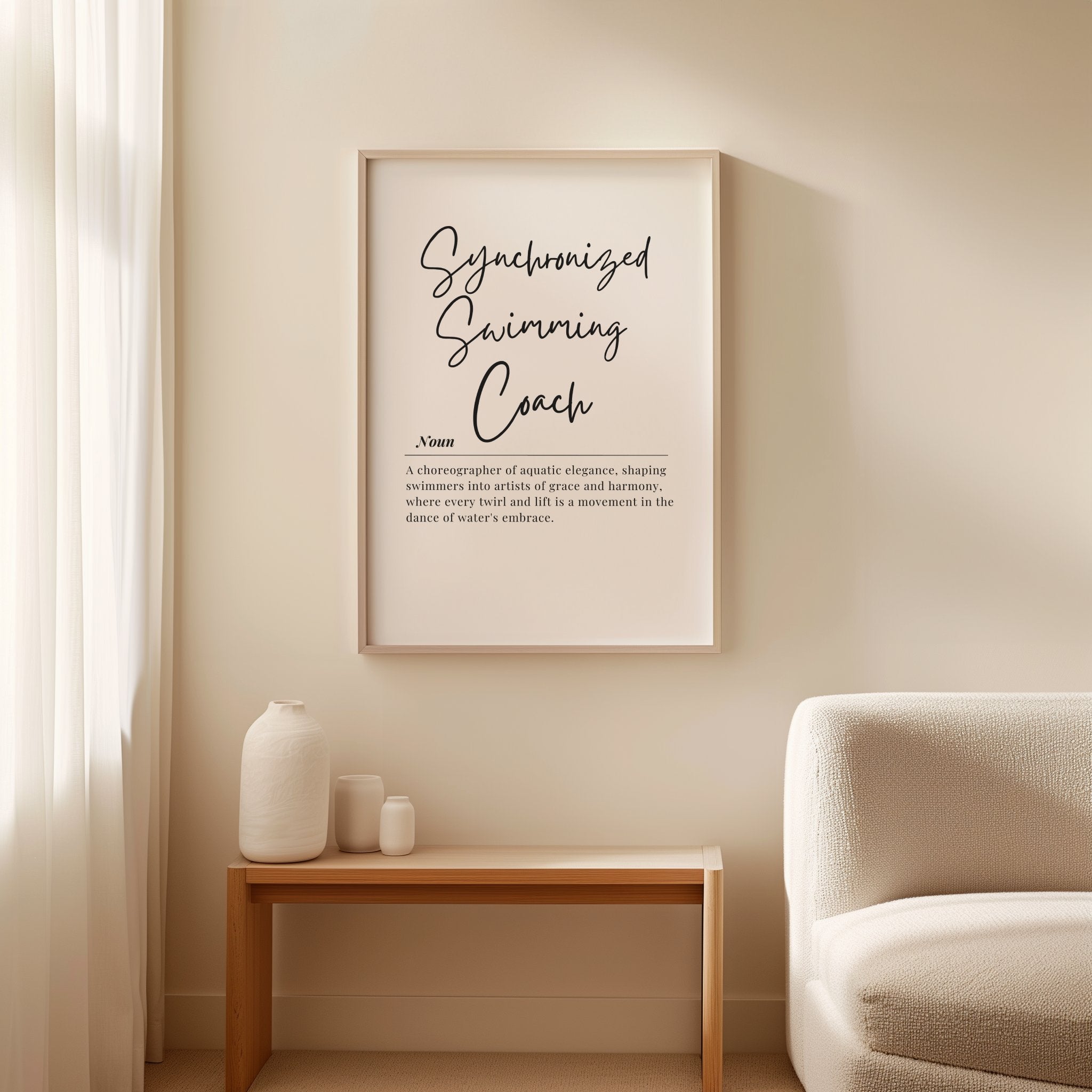 Minimalist typographic print with 'Synchronized Swimming Coach' in elegant charcoal gray script against white background, framed in clean wood, ideal for coaching offices or aquatic facilities.