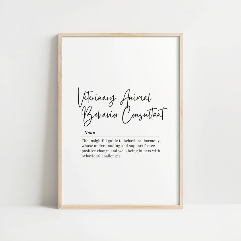 Elegant black script 'Veterinary Animal Behavior Consultant' with inspirational definition against white background in wooden frame, creating a sophisticated professional tribute to animal behavior specialists.