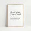 Modern monochrome veterinary definition print with elegant script title and serif text against white background, framed in natural wood, perfect for professional clinic spaces.
