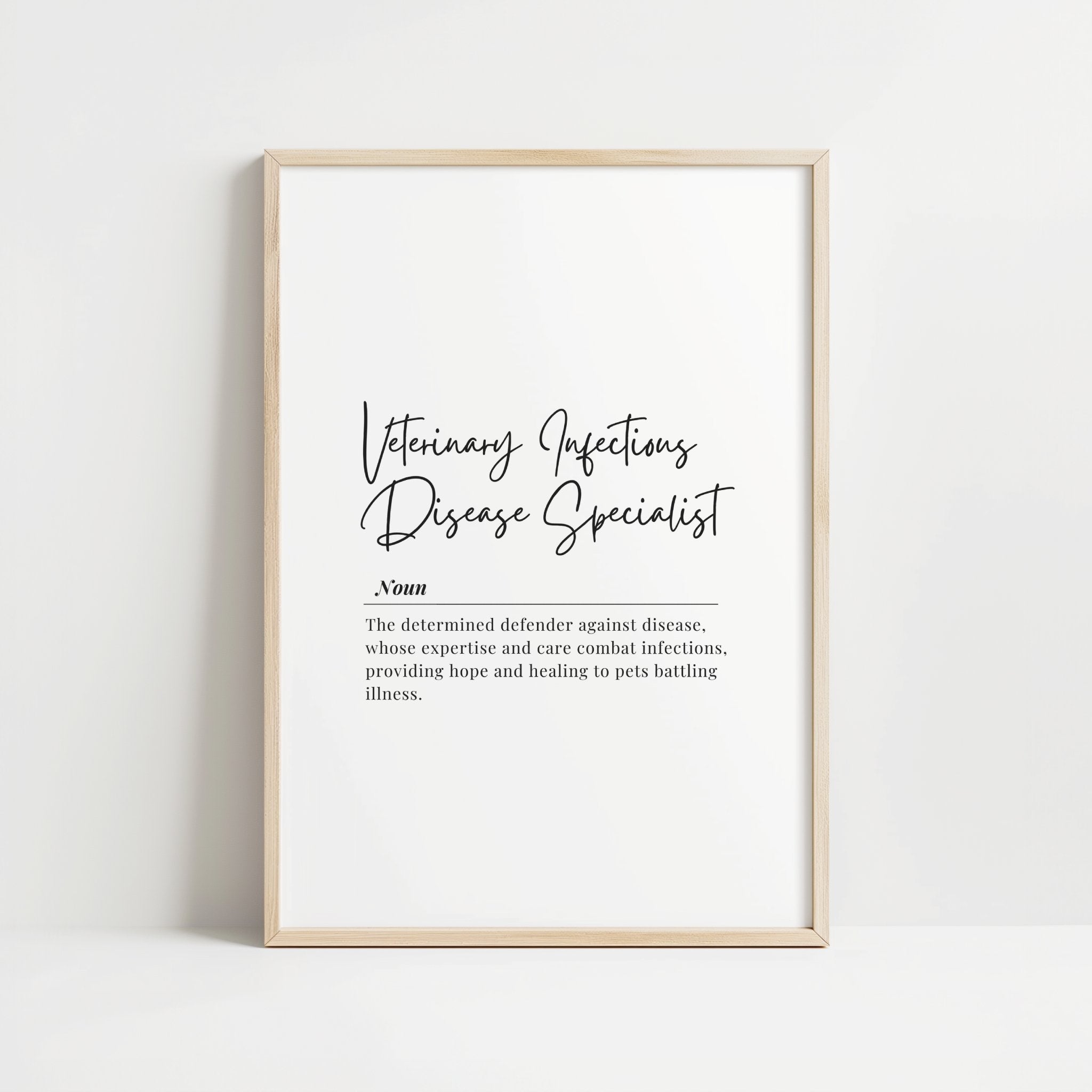 Elegant typography print featuring Veterinary Infectious Disease Specialist definition in black script and serif fonts against white background, framed in modern wood tones, conveying professionalism and dedication to animal care.
