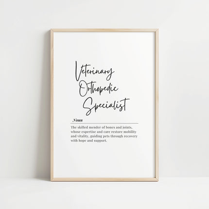 Black script typography displaying 'Veterinary Orthopedic Specialist' with elegant definition text against white background, framed in light wood, conveying professional inspiration for clinical settings.