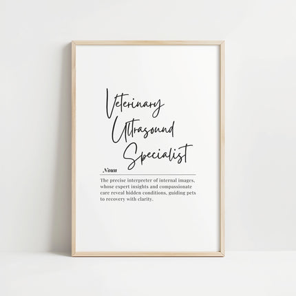 Modern typography print featuring 'Veterinary Ultrasound Specialist' in elegant script with serif explanatory text on white background, framed in clean wood, conveying professional sophistication for clinical settings.