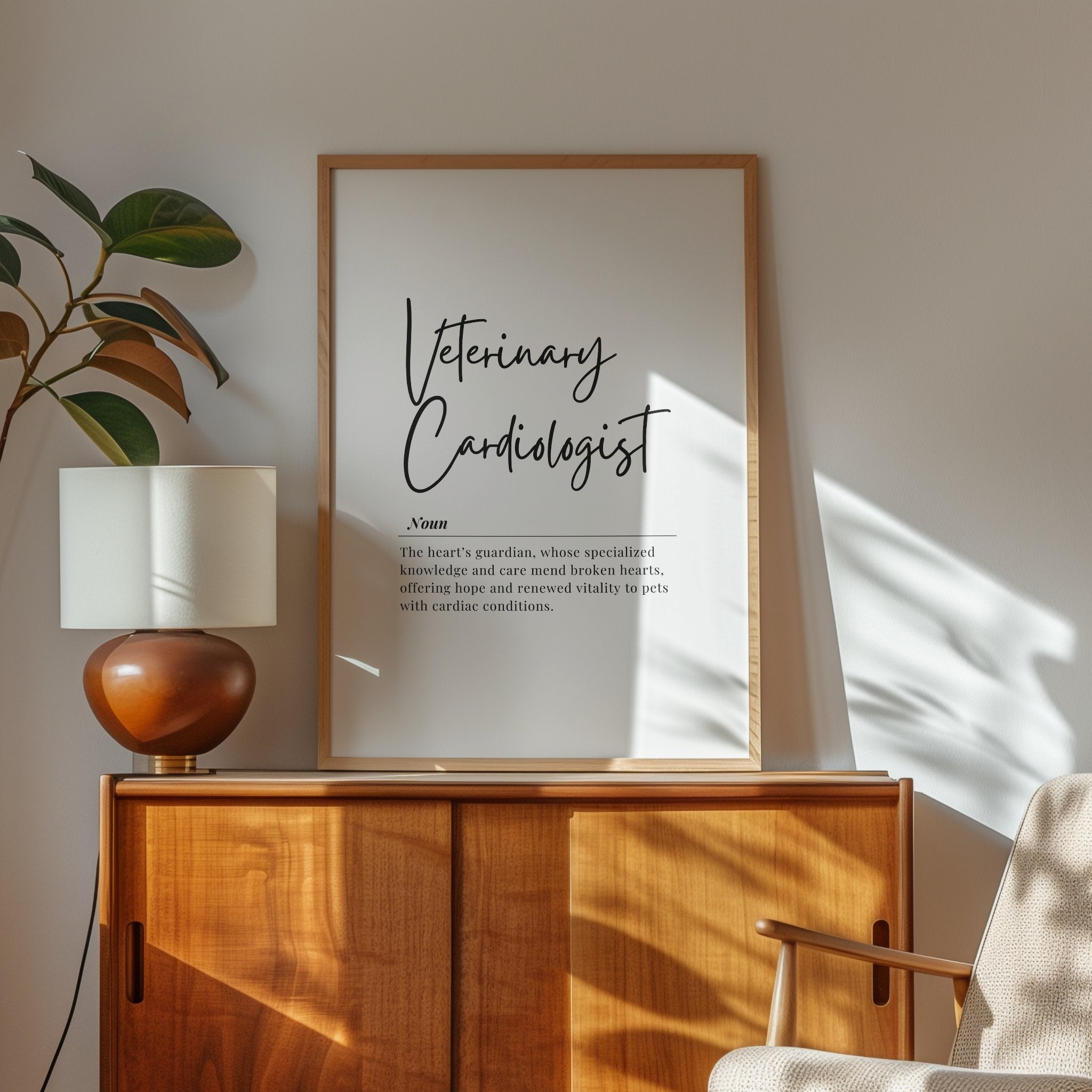 Elegant typography print featuring 'Veterinary Cardiologist' in black script against white background, with definition text describing heart guardians who mend pets' cardiac conditions, framed in light wood.
