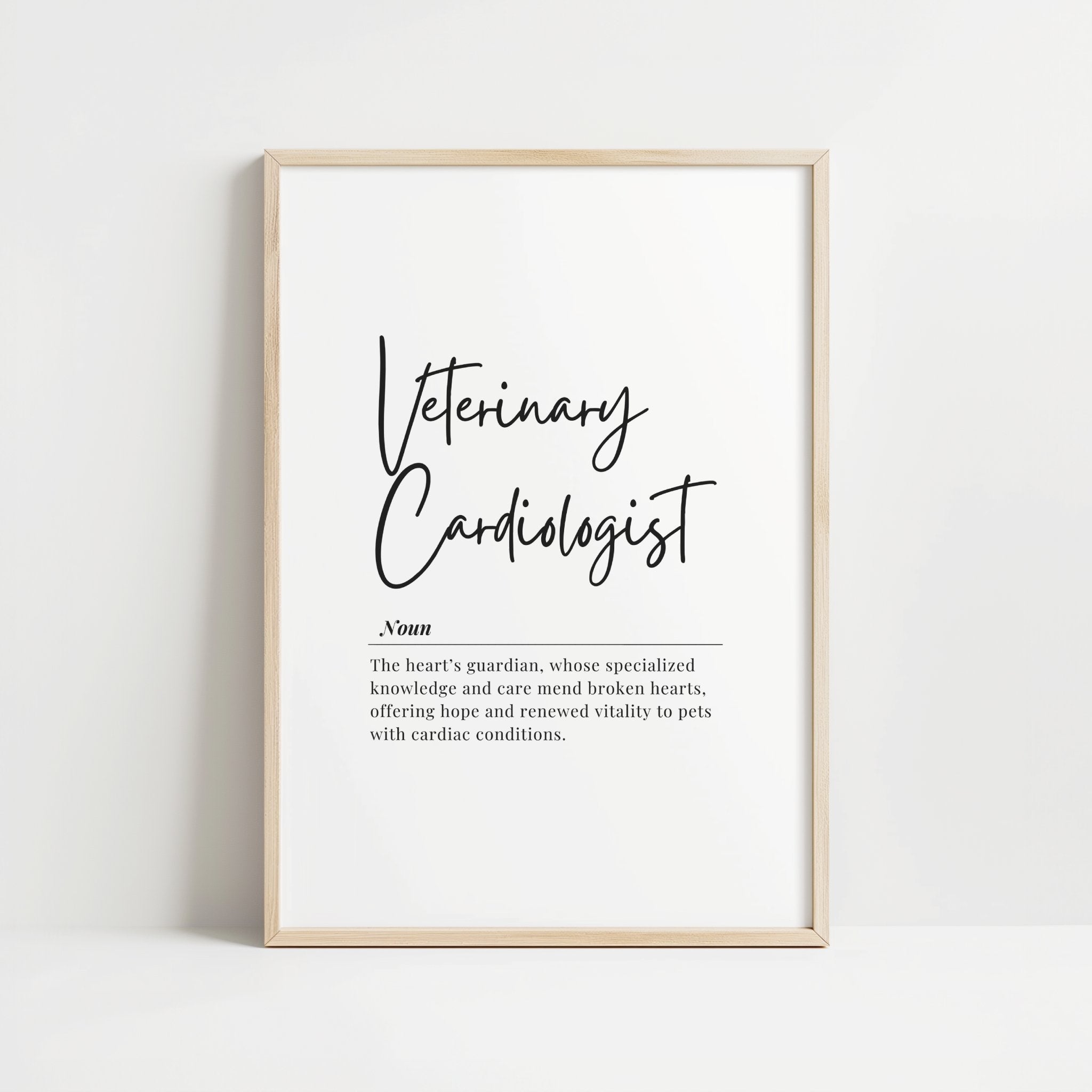 Elegant typography print featuring 'Veterinary Cardiologist' in black script against white background, with definition text describing heart guardians who mend pets' cardiac conditions, framed in light wood.