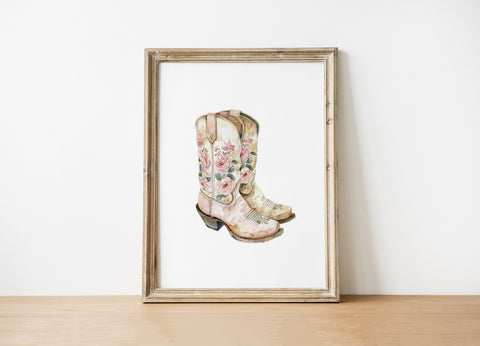Delicate watercolor cowboy boots with intricate floral patterns in soft blush pink, cream and sage green against white background, creating whimsical rustic charm for farmhouse decor