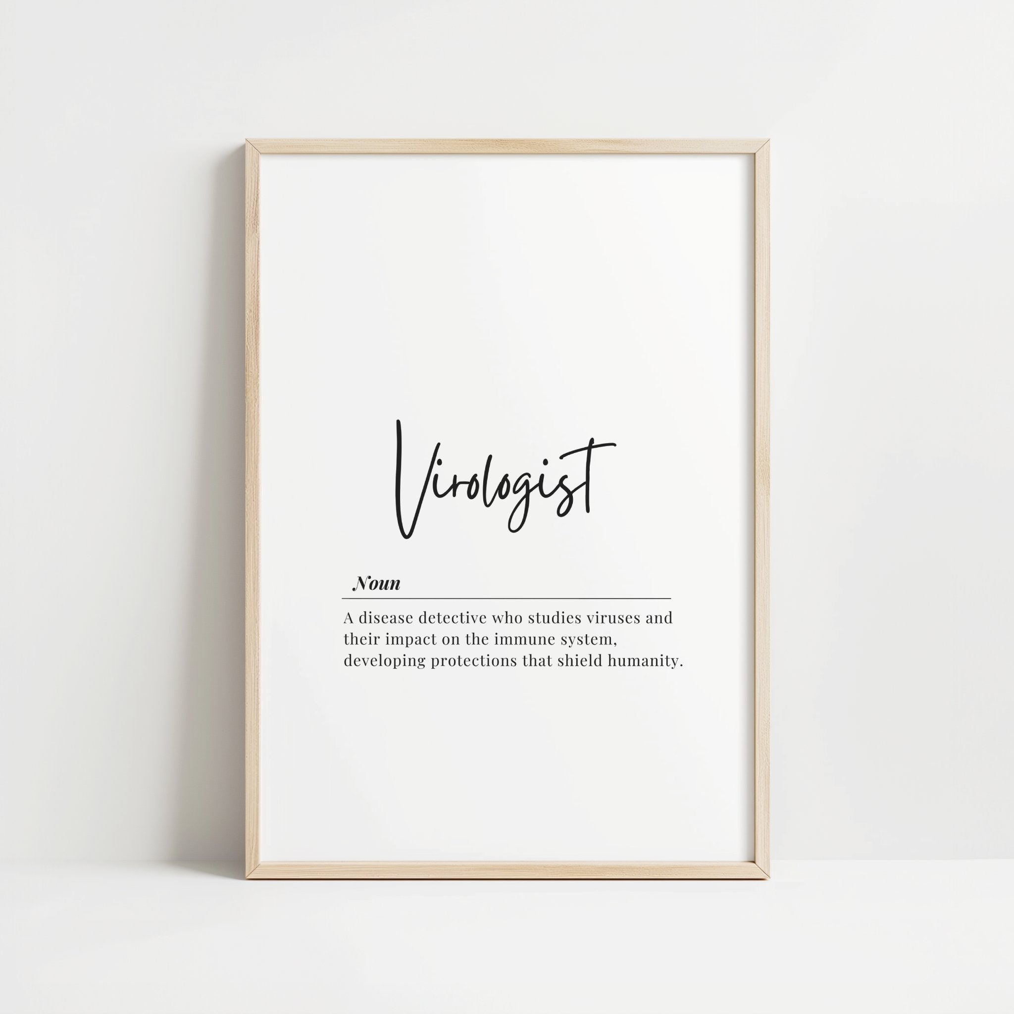 Elegant minimalist virologist definition print with black script typography against white background, featuring professional wooden frame and contemporary design perfect for medical offices or educational spaces.