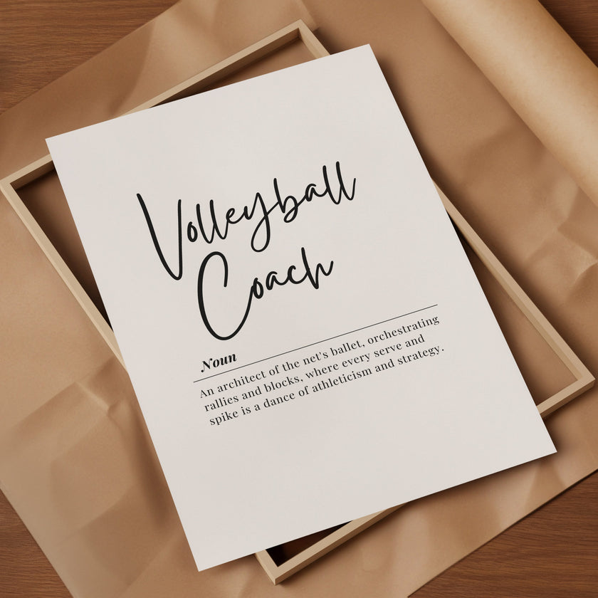 Elegant minimalist typography print featuring 'Volleyball Coach' in black cursive script on white background with inspirational definition text in serif font, presented in a sleek wooden frame.
