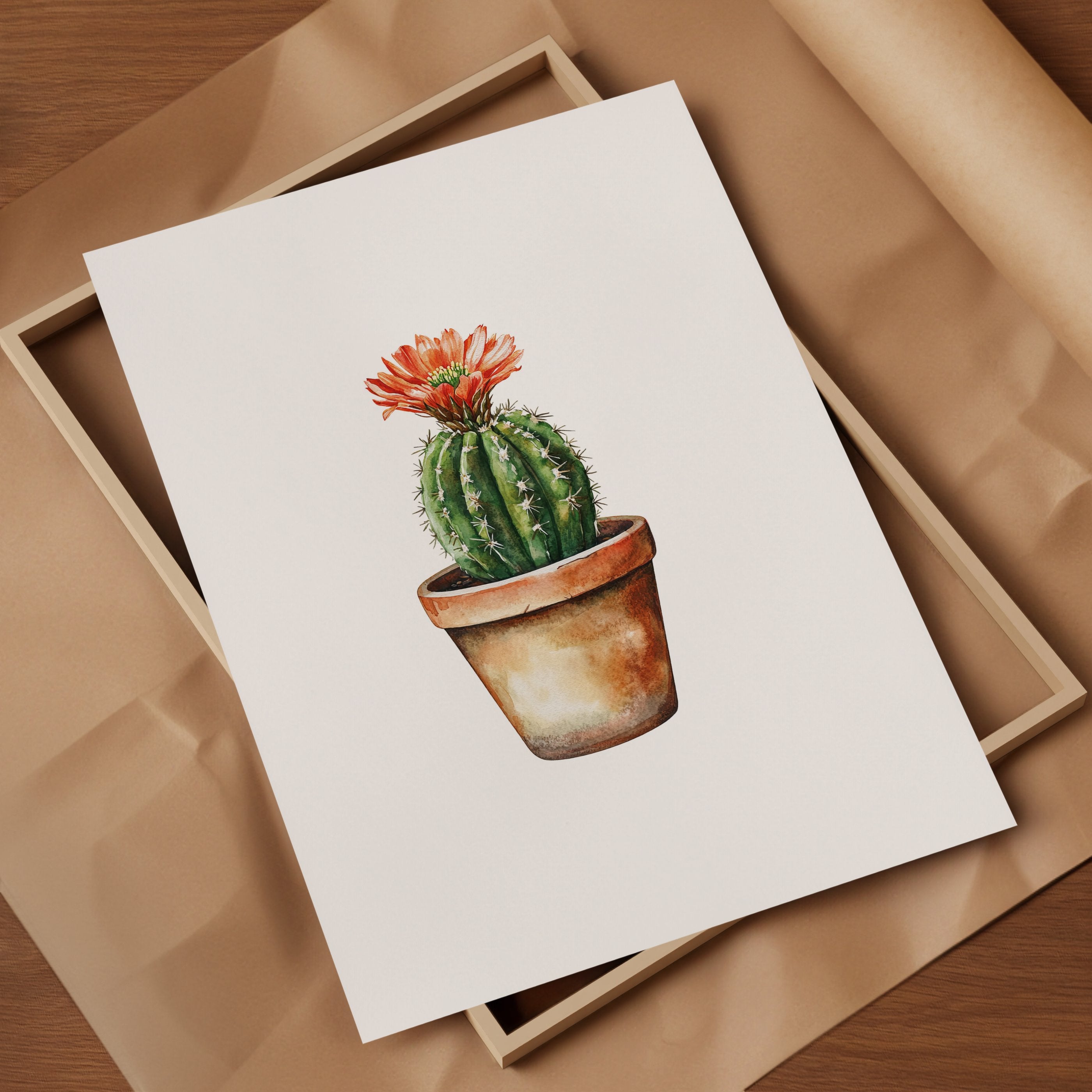 Hand-painted watercolor cactus with vibrant coral flower against white background, featuring earthy terracotta and sage green tones in a minimalist, calming composition perfect for bohemian spaces.
