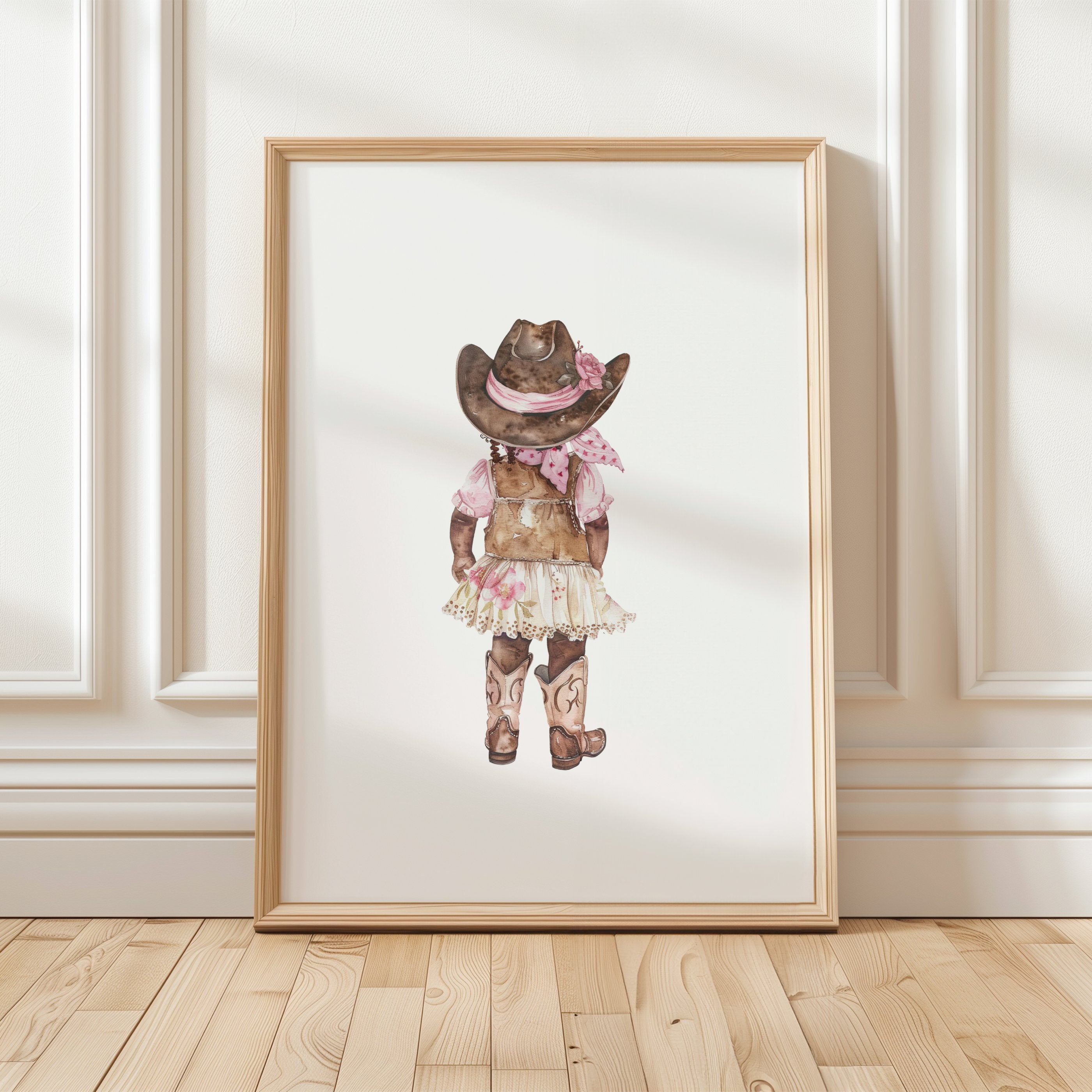 Whimsical watercolor cowgirl illustration in earthy browns, soft pinks, and cream, featuring intricately designed cowboy hat and boots with delicate floral accents, perfect for country-themed nurseries.