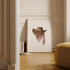 Rustic watercolor cowboy hat with pink polka dot bandana against white background, featuring detailed brushstrokes and soft muted colors perfect for farmhouse and western-themed spaces.