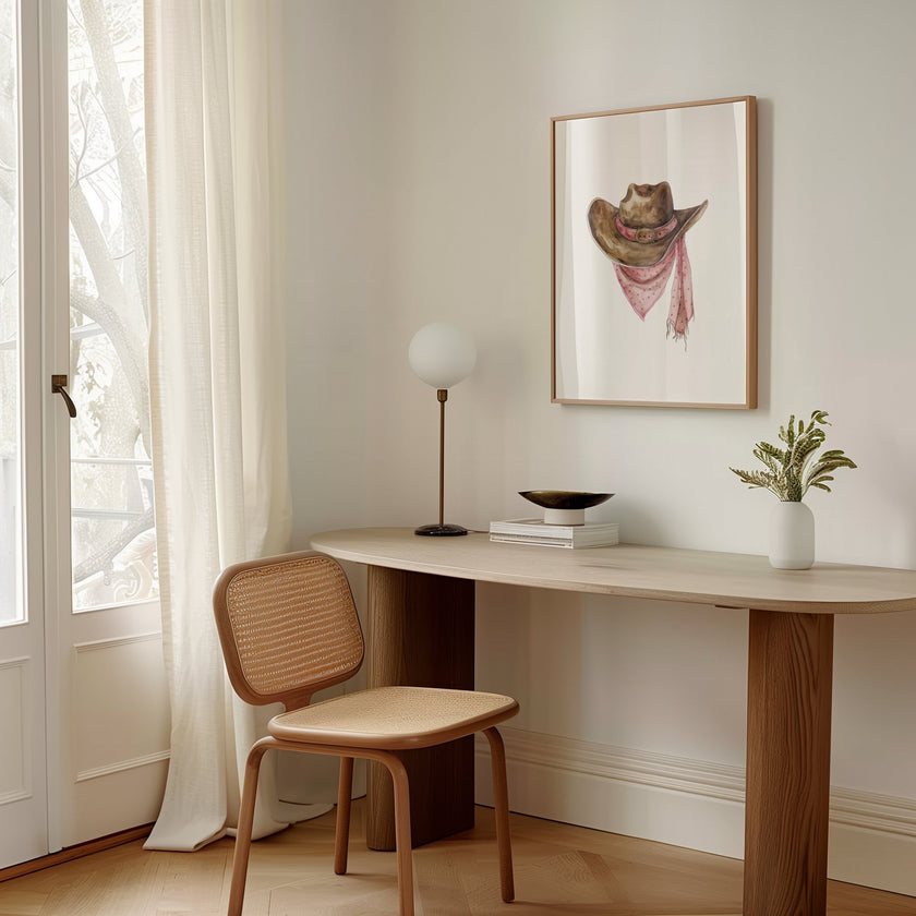 Rustic watercolor cowboy hat with pink polka dot bandana against white background, featuring detailed brushstrokes and soft muted colors perfect for farmhouse and western-themed spaces.
