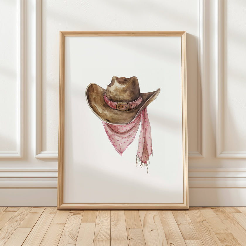 Rustic watercolor cowboy hat with pink polka dot bandana against white background, featuring detailed brushstrokes and soft muted colors perfect for farmhouse and western-themed spaces.