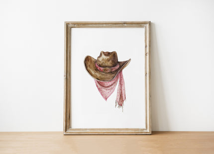 Rustic watercolor cowboy hat with pink polka dot bandana against white background, featuring detailed brushstrokes and soft muted colors perfect for farmhouse and western-themed spaces.