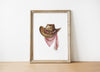 Rustic watercolor cowboy hat with pink polka dot bandana against white background, featuring detailed brushstrokes and soft muted colors perfect for farmhouse and western-themed spaces.