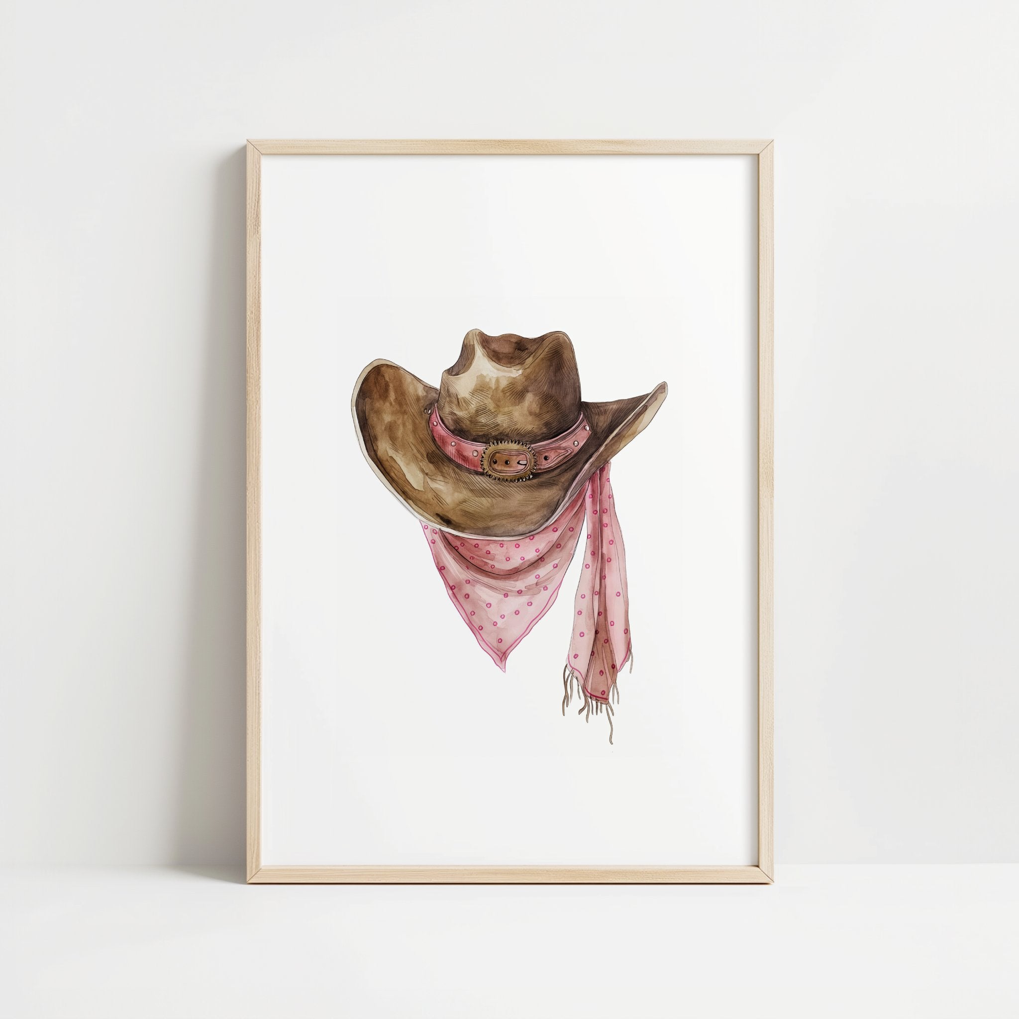 Rustic watercolor cowboy hat with pink polka dot bandana against white background, featuring detailed brushstrokes and soft muted colors perfect for farmhouse and western-themed spaces.