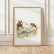 Serene watercolor scene of woman and horse in meadow, depicted in warm chestnut brown, sage green and gold tones on minimalist white background with rustic wooden frame elements