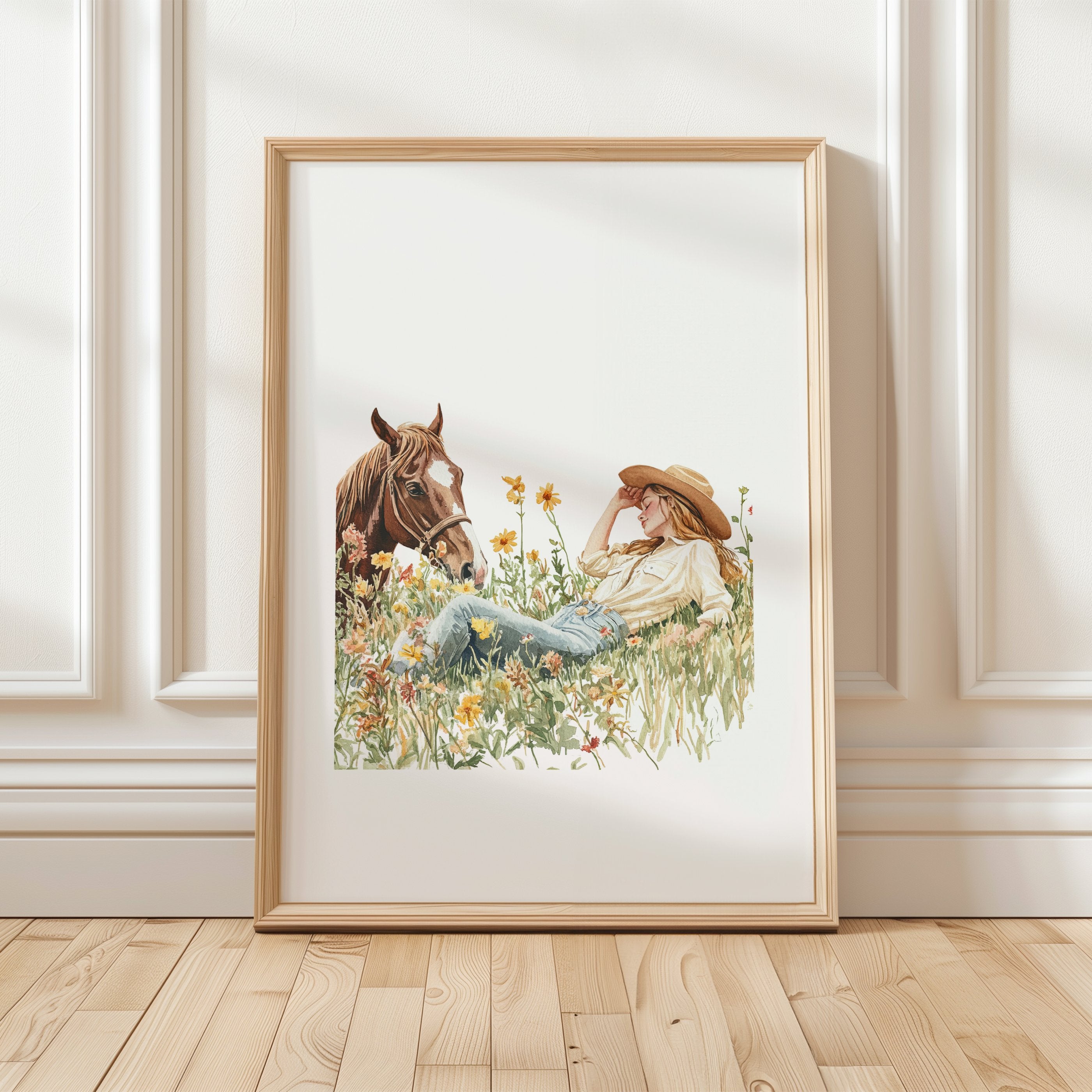 Serene watercolor scene of woman and horse in meadow, depicted in warm chestnut brown, sage green and gold tones on minimalist white background with rustic wooden frame elements