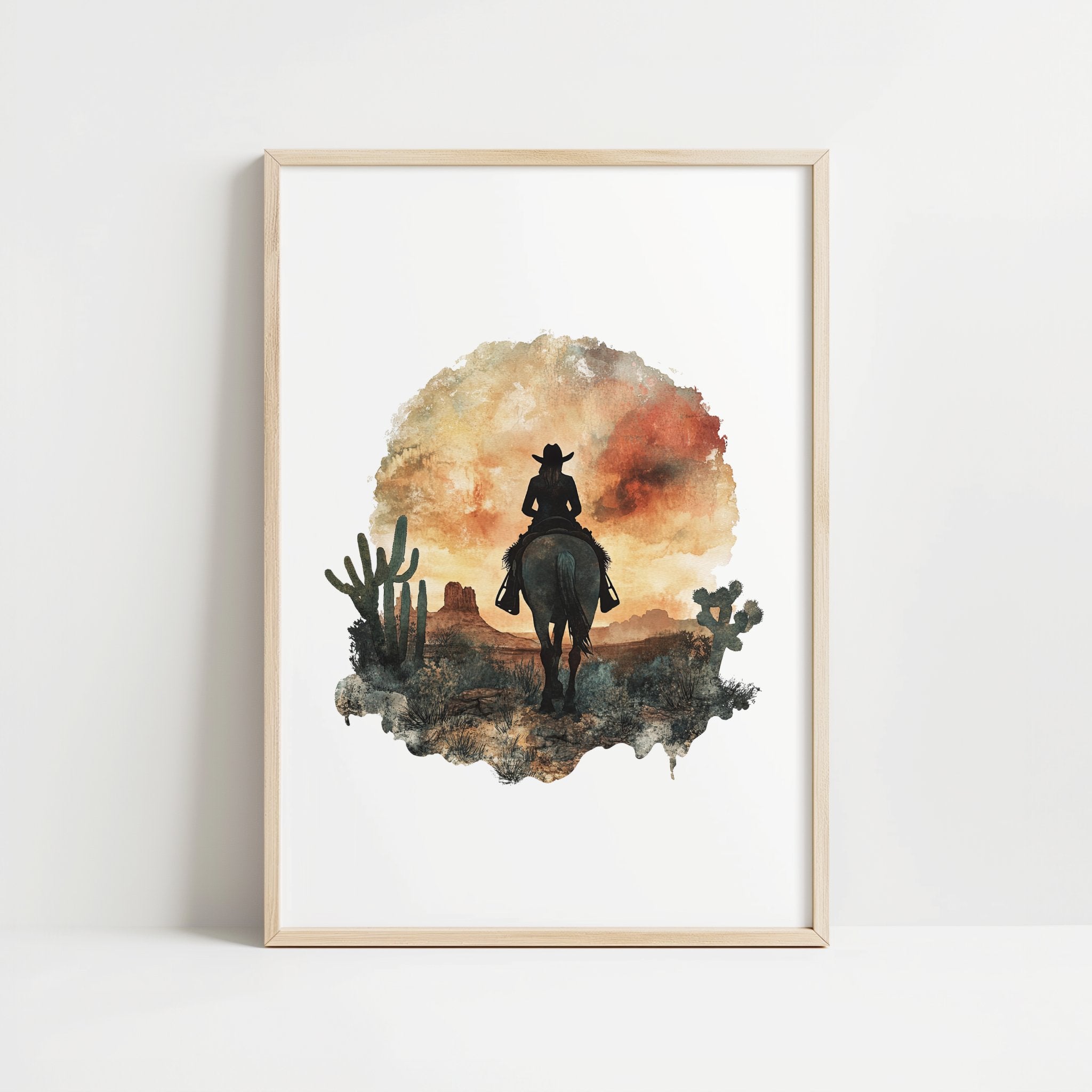 Watercolor silhouette of a cowboy on horseback against desert sunset hues of russet and ochre, framed by cacti with textured white space creating nostalgic, adventurous atmosphere.