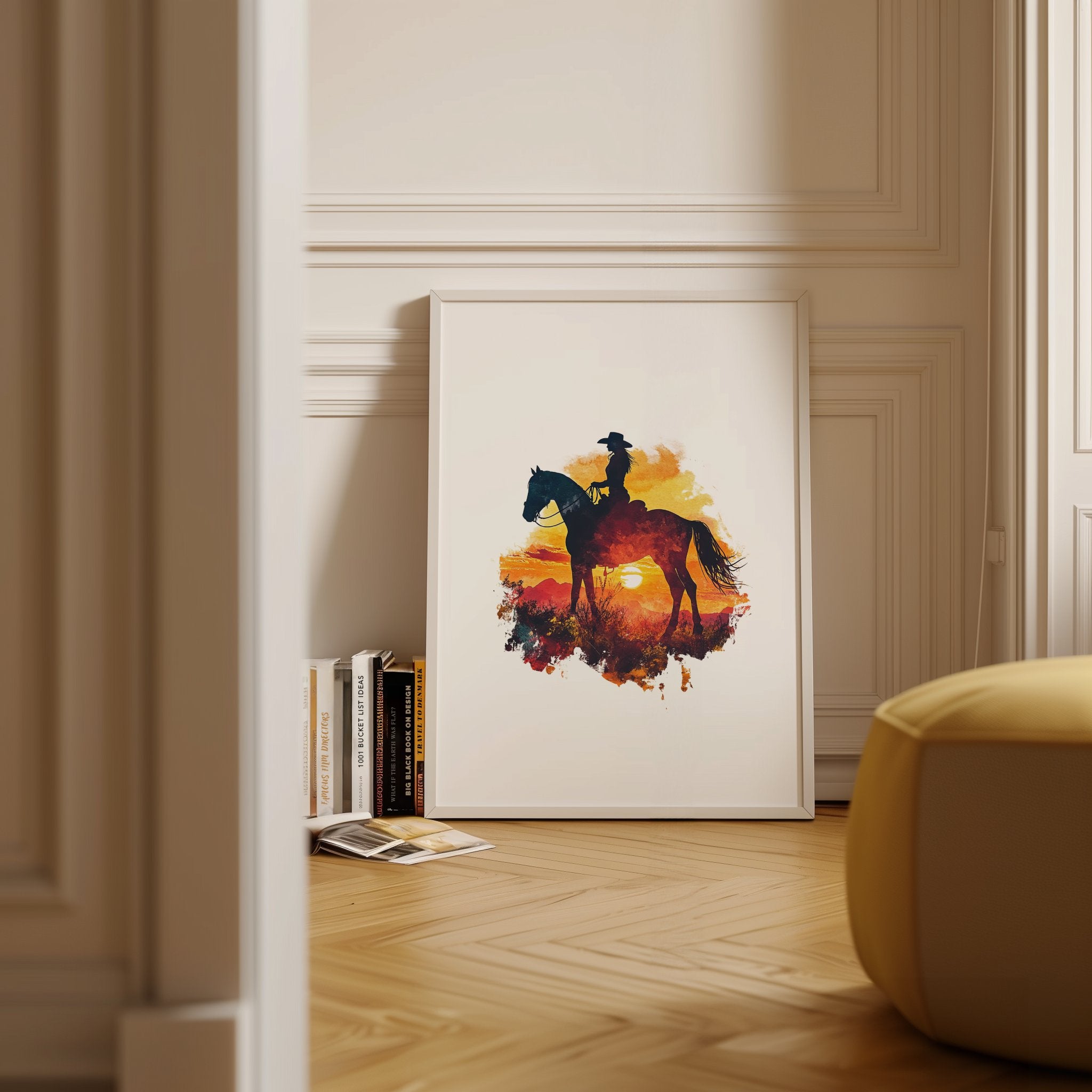 Dramatic silhouette of cowboy on horseback against vibrant orange, red and yellow sunset, featuring textured watercolor splashes creating a nostalgic, adventurous western landscape perfect for rustic decor.