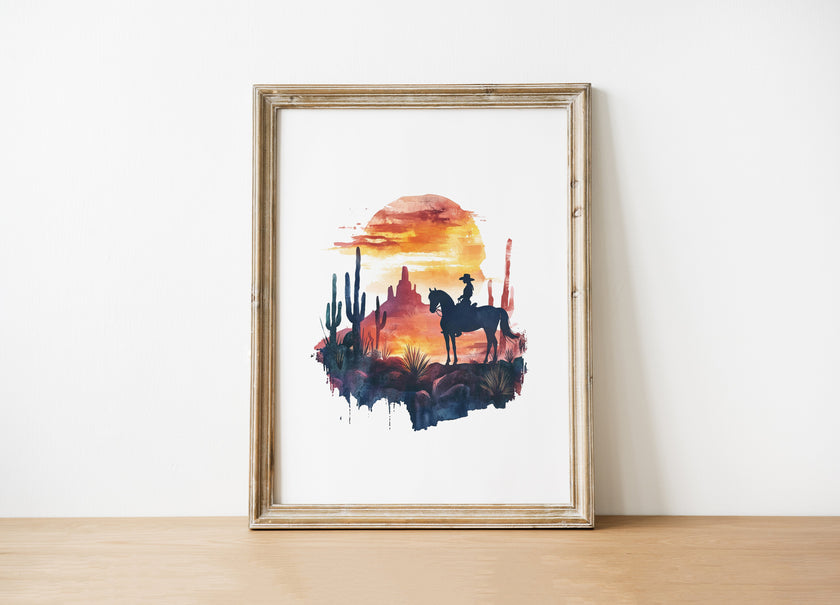 Silhouetted cowboy on horseback against vibrant orange and red sunset with navy blue mountains, cacti and desert formations creating a powerful rustic southwestern aesthetic.