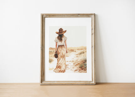 Serene vintage illustration of a solitary woman in wide-brimmed hat walking through desert landscape, rendered in soft sepia tones and sandy beige with minimalist sage green accents.
