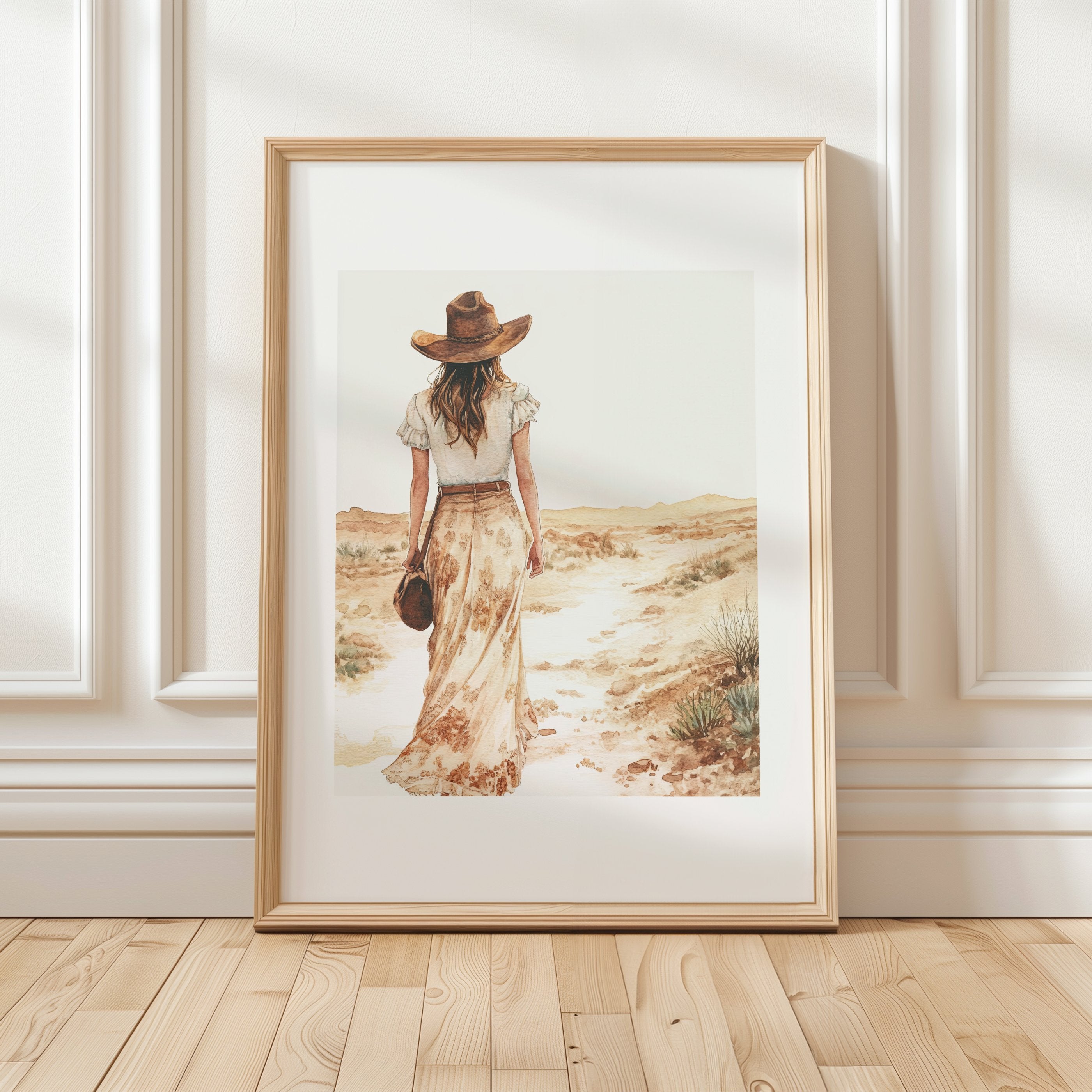 Serene vintage illustration of a solitary woman in wide-brimmed hat walking through desert landscape, rendered in soft sepia tones and sandy beige with minimalist sage green accents.