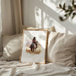 Watercolor cowgirl riding horse at sunset with soft pastel tones of blush pink, amber and lavender, creating a serene western-themed focal point against white space.