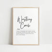 Minimalist black and white typography print with 'Wrestling Coach' in bold black script against a white background, paired with an inspirational serif font definition below, presented in a sleek wooden frame.