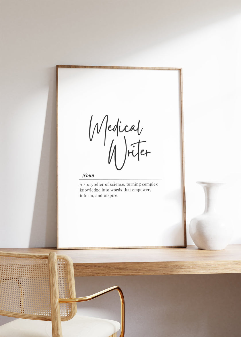 Minimalist black and white typography print featuring 'Medical Writer' definition in bold script against white background, professionally framed with wooden accents for medical and academic settings.