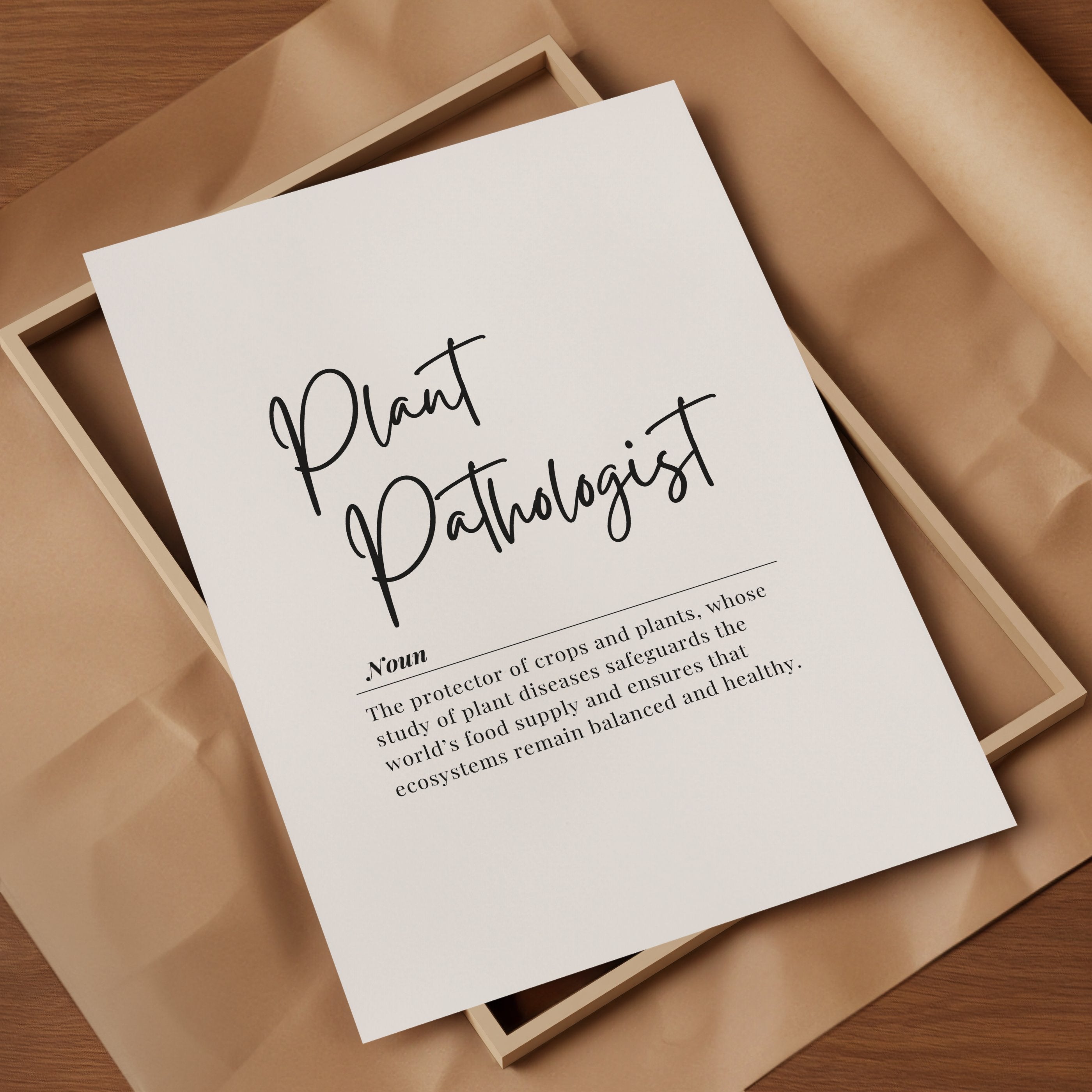 Black script typography defining 'Plant Pathologist' on white background with serif text explaining their role in protecting crops and maintaining ecosystem balance, framed in wood with Scandinavian minimalist design