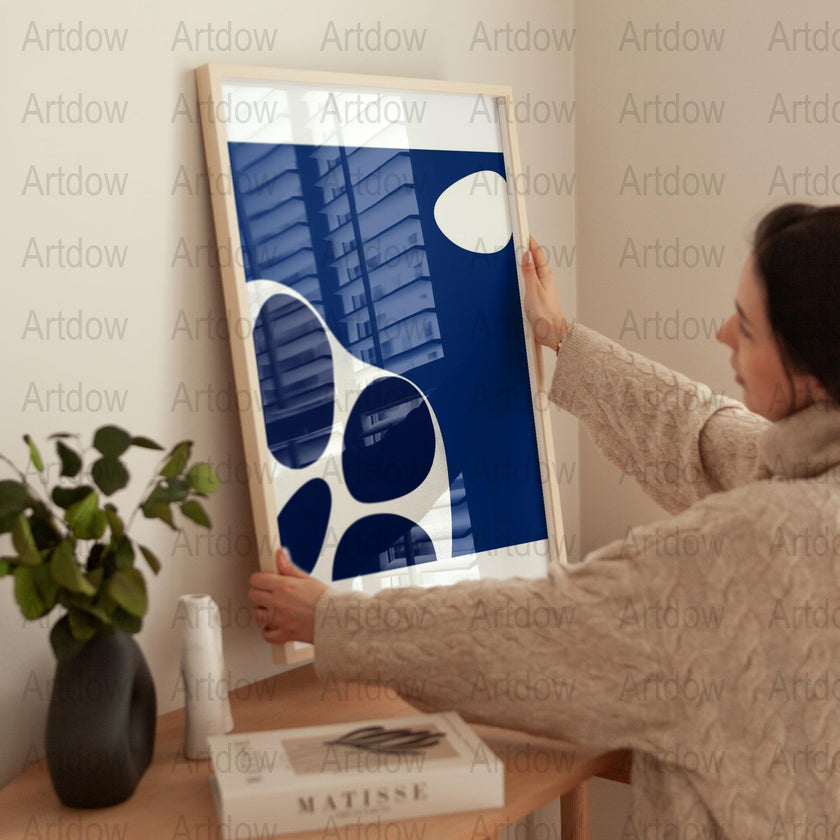 Modern abstract design featuring flowing navy blue and crisp white shapes against a blue background, creating a balanced, peaceful composition ideal for minimalist contemporary spaces.