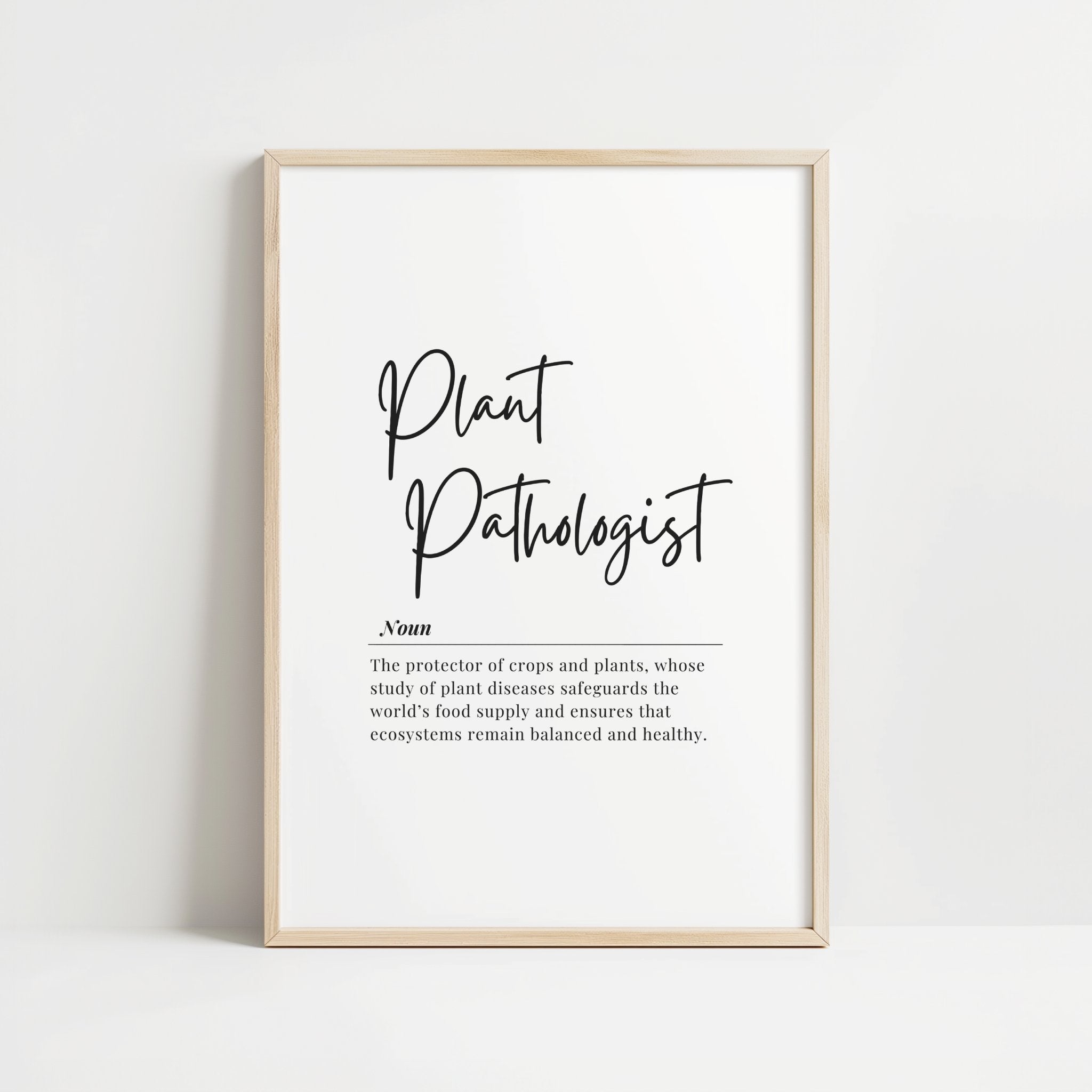 Black script typography defining 'Plant Pathologist' on white background with serif text explaining their role in protecting crops and maintaining ecosystem balance, framed in wood with Scandinavian minimalist design