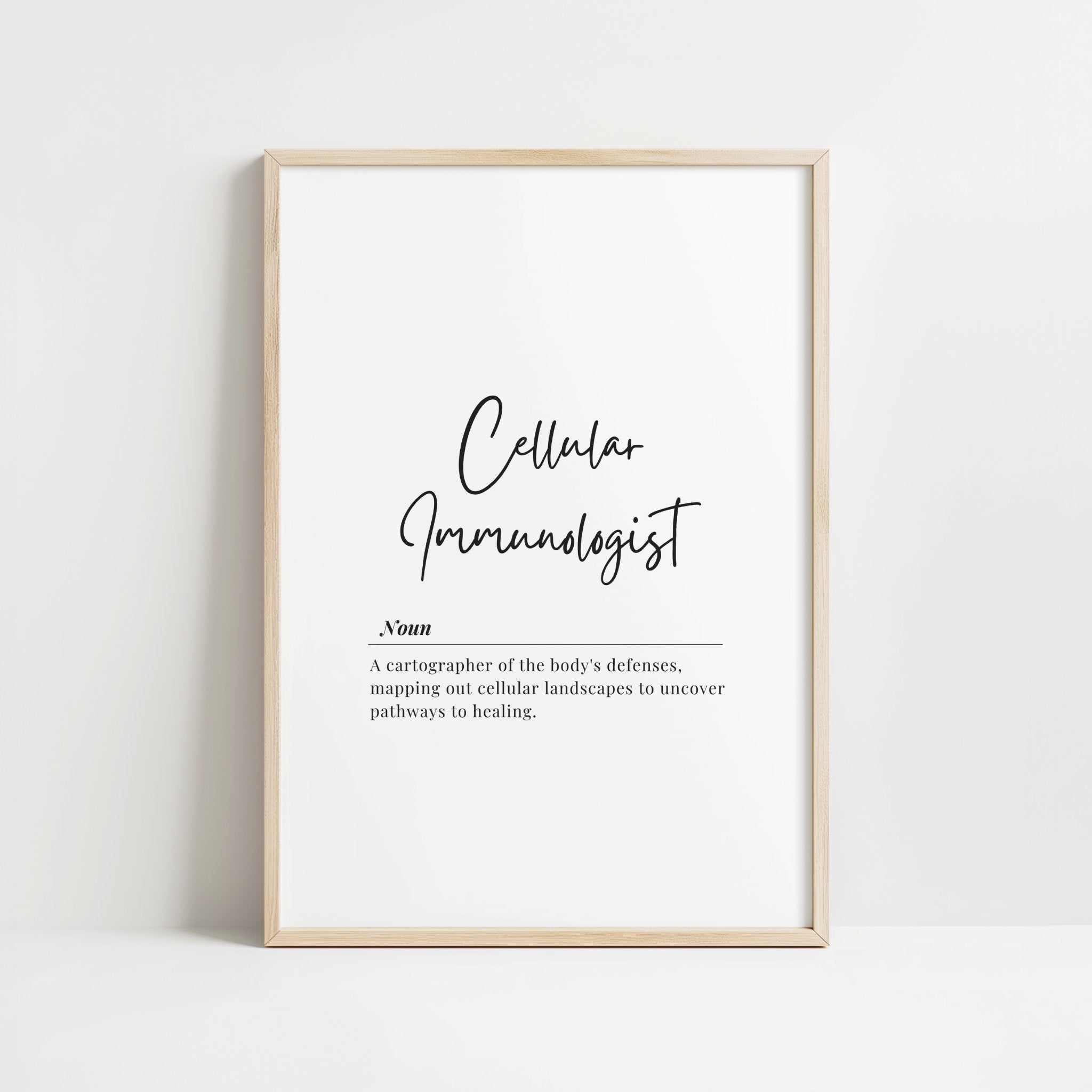Black typography print featuring 'Cellular Immunologist' in elegant script with a professional definition in serif font against a clean white background, framed in modern wood.